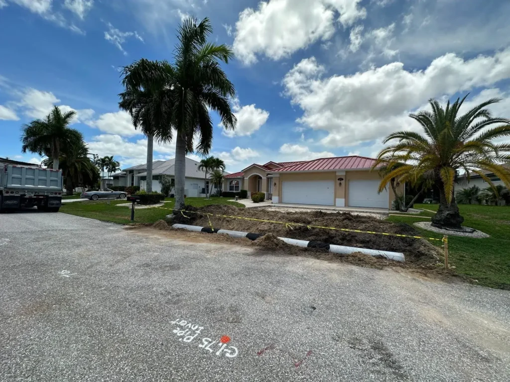 Different angle of culvert installation in front of a house.