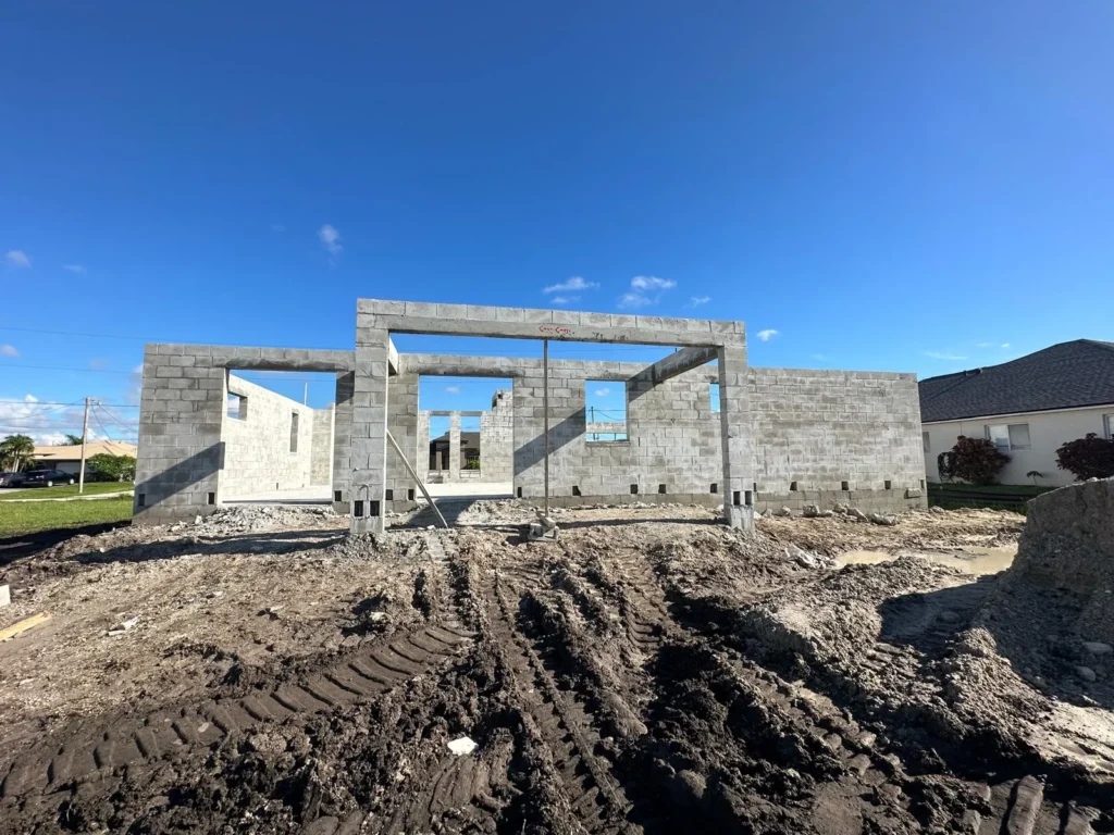 Front view of masonry walls up before trusses and dry-in.