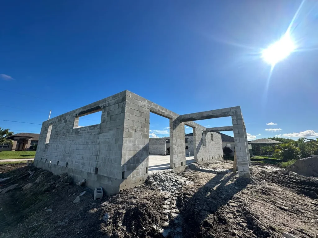 Angle view of masonry walls under construction.