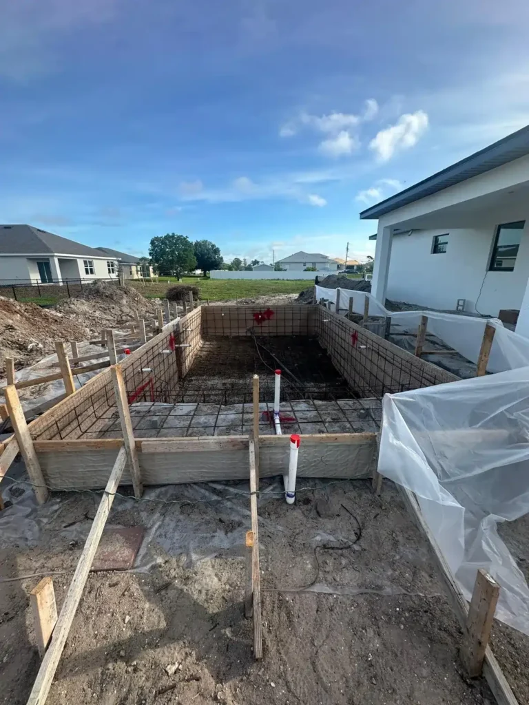 Initial stages of pool construction with wooden formwork.