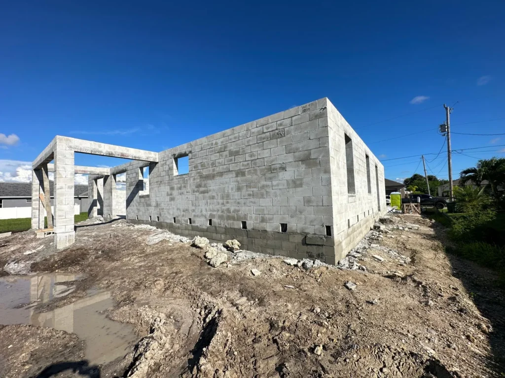 Stem wall meets with masonry rows during construction.