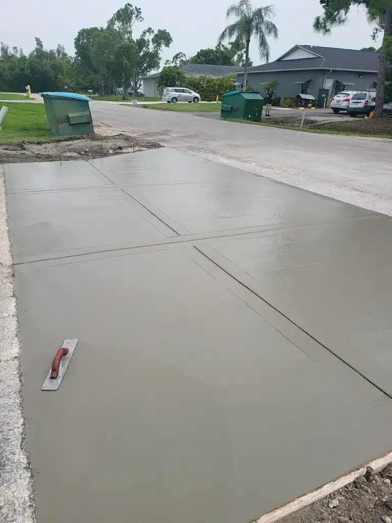 Finished commercial concrete driveway smoothed by hand.