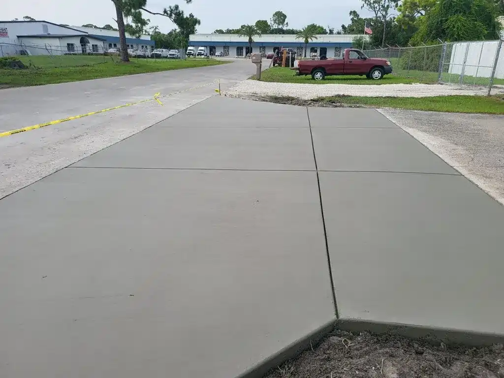 Smooth, newly finished concrete driveway.