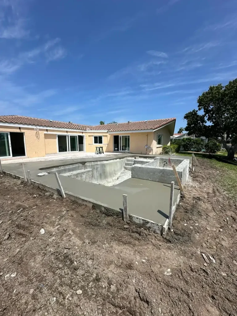 Pool renovation with concrete and tile work in progress.