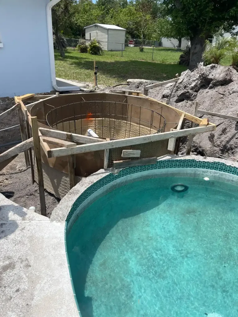 Pool renovation with circular concrete framework and rebar.