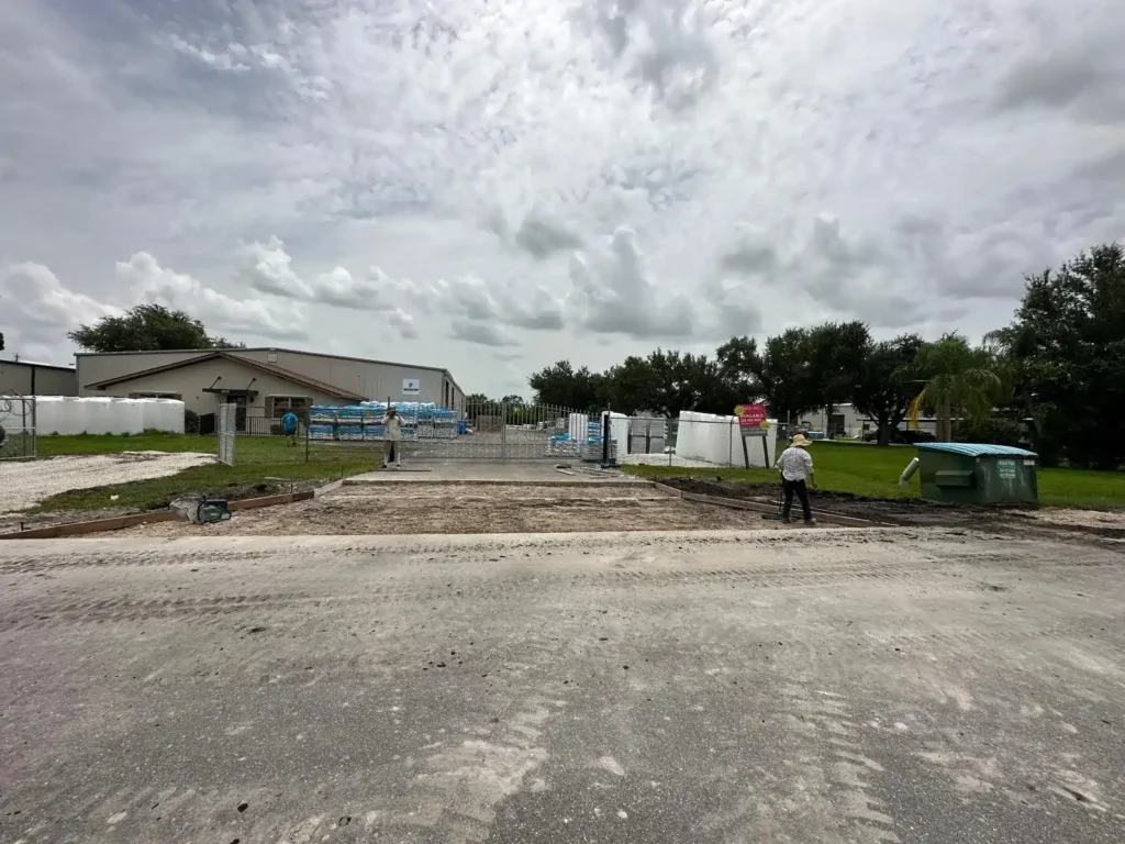 Workers preparing the area before pouring concrete over the culvert.