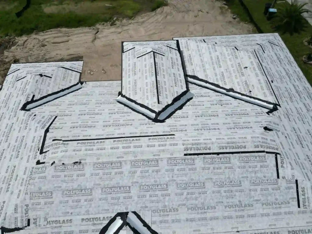 Closer view of roof underlayment installation, showing detailed workmanship.