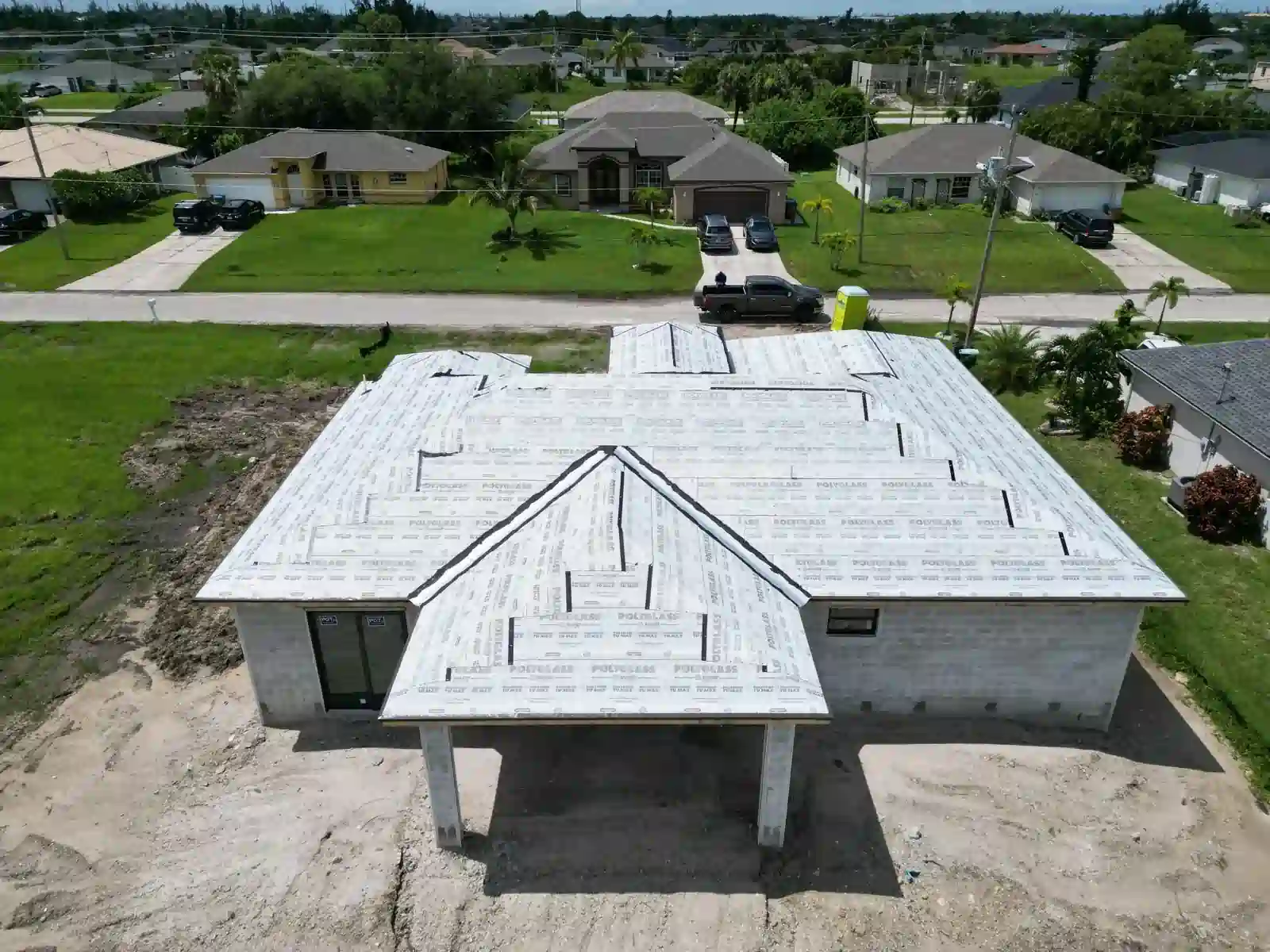 Front view of roof underlayment installation on a new home.