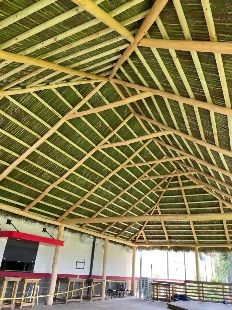 Interior view of an extra-large tiki hut with spacious open areas.