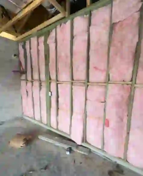 Insulation installed in a wall during a renovation project by Tarpon Gulf.