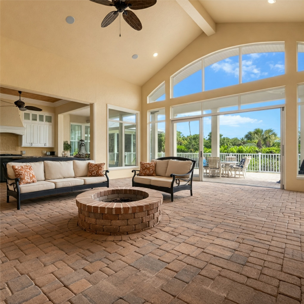 A cozy brick paver fire pit in a luxury Florida home.