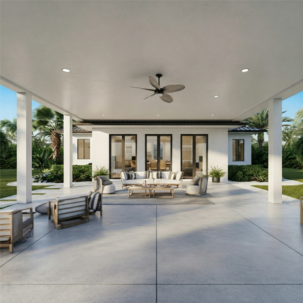 Spacious concrete patio with modern furniture and lush landscaping, overlooking a sparkling pool in a Florida luxury home.