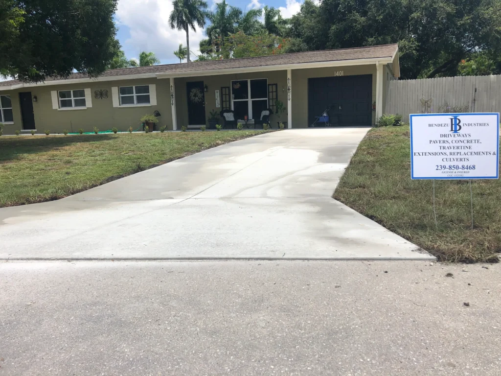 Brand-new concrete driveway remodel with a smooth, polished finish.